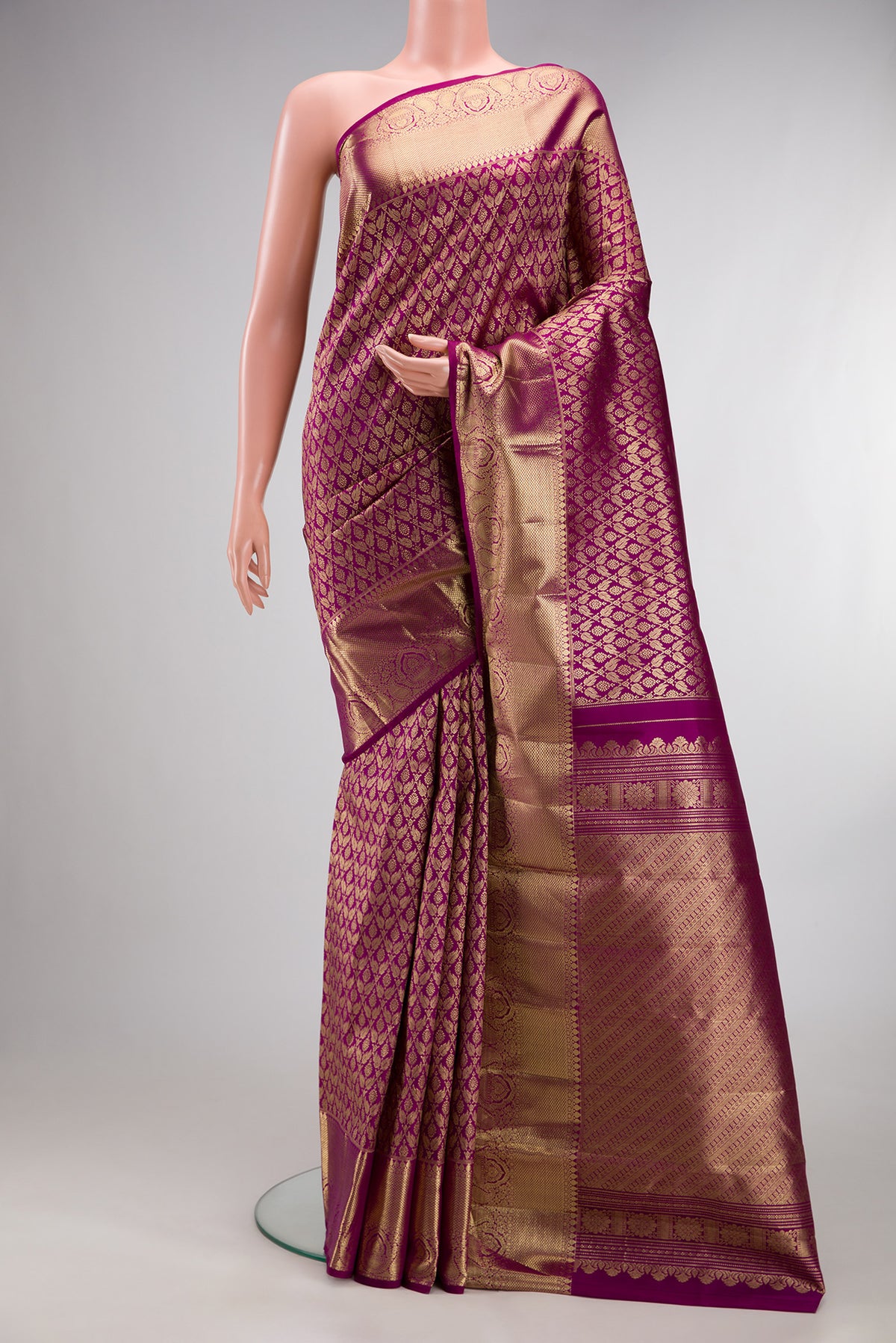 Pure Silk Magenta Dual Tone Kanjivaram Saree with Zari Brocade on the body and Zari Border.  displayed on a mannequin