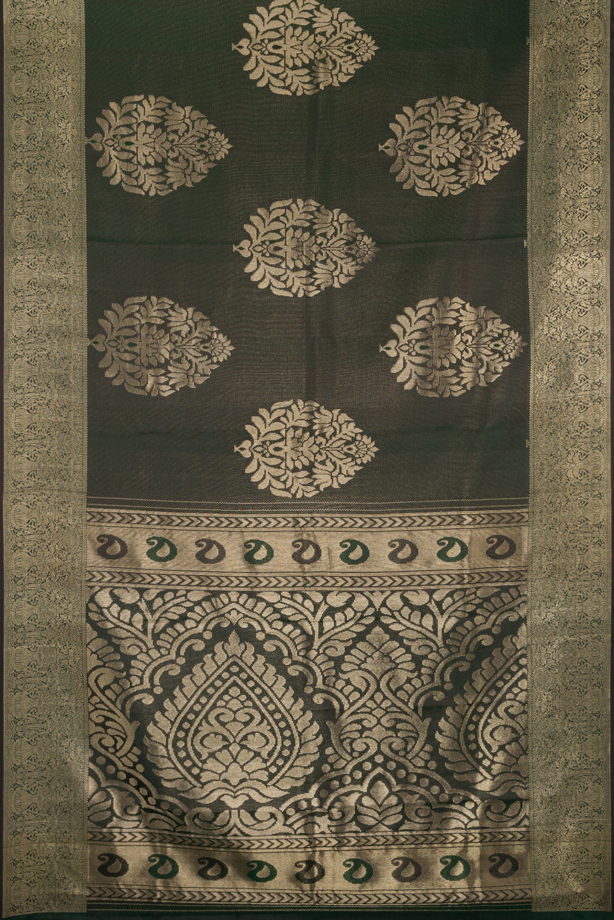 Flat view of Bottle Green Kanjivaram Silk Saree with Zari Brocade on the body and Fancy Border. 