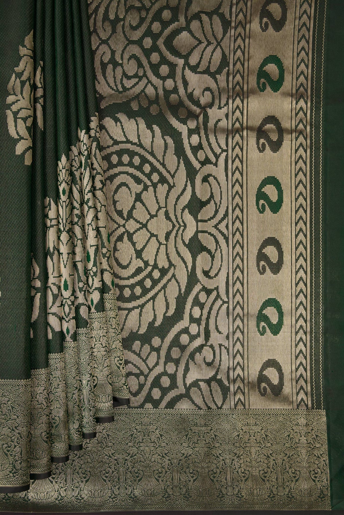 Pleats and pallu of Bottle Green Kanjivaram Silk Saree with Zari Brocade on the body and Fancy Border. 
