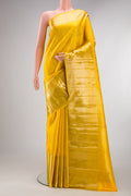 Pure Silk Yellow Kanjivaram Saree with Stripes on the body and Zari Border.  displayed on a mannequin