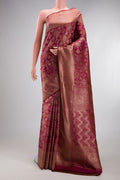 Maroon Kanjivaram Silk Saree with Zari Brocade on the body and Fancy Border.  displayed on a mannequin