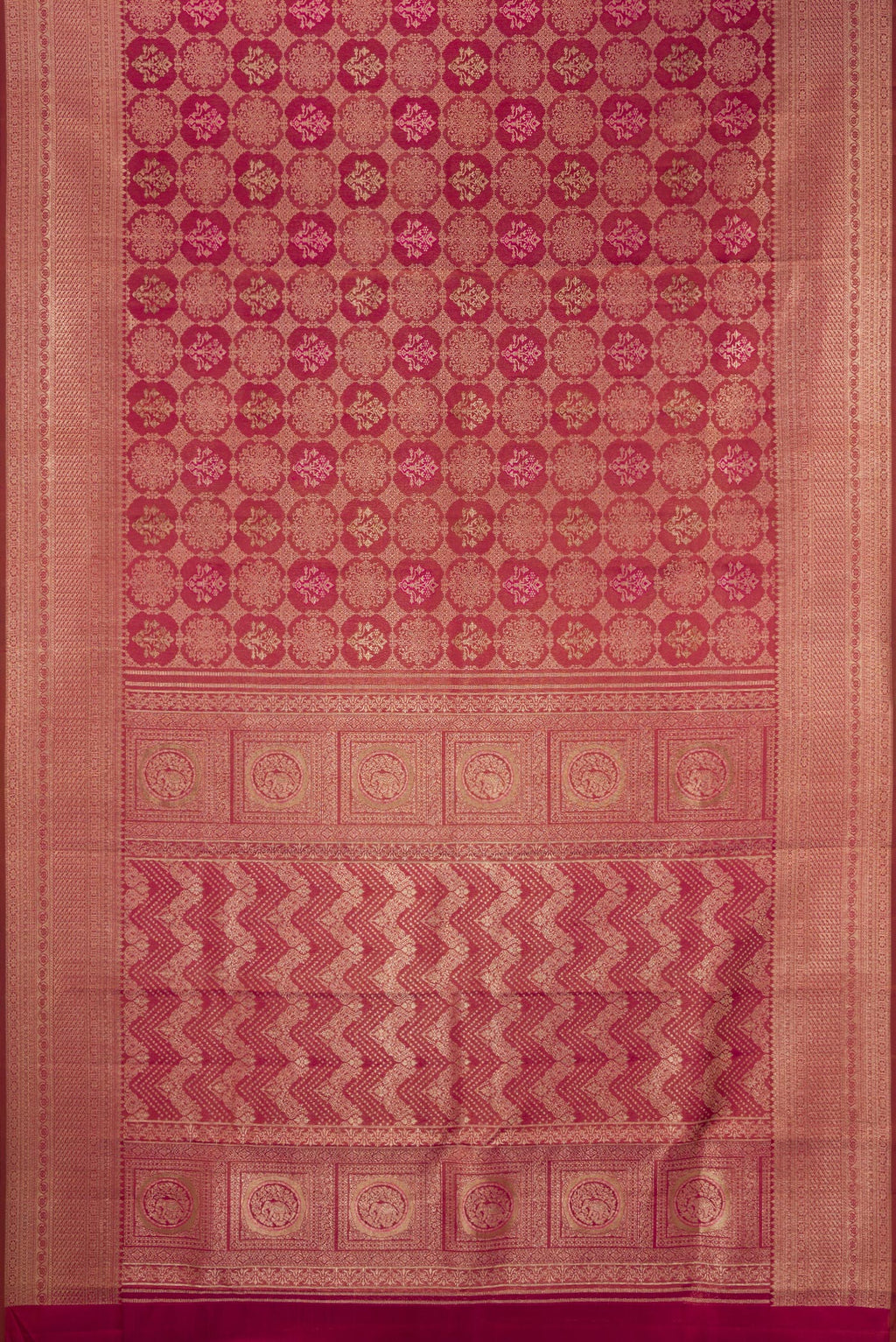 Flat view of Maroon Kanjivaram Silk Saree with Zari Brocade on the body and Fancy Border. 