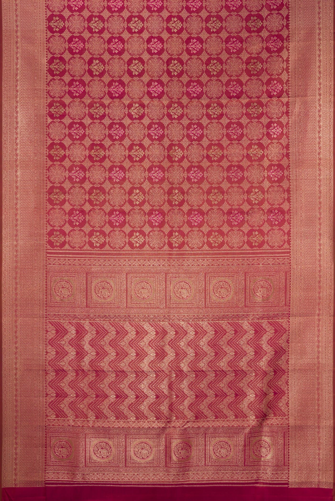 Flat view of Maroon Kanjivaram Silk Saree with Zari Brocade on the body and Fancy Border. 