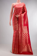 Red Kanjivaram Silk Saree with Zari Brocade on the body and Fancy Border.  displayed on a mannequin