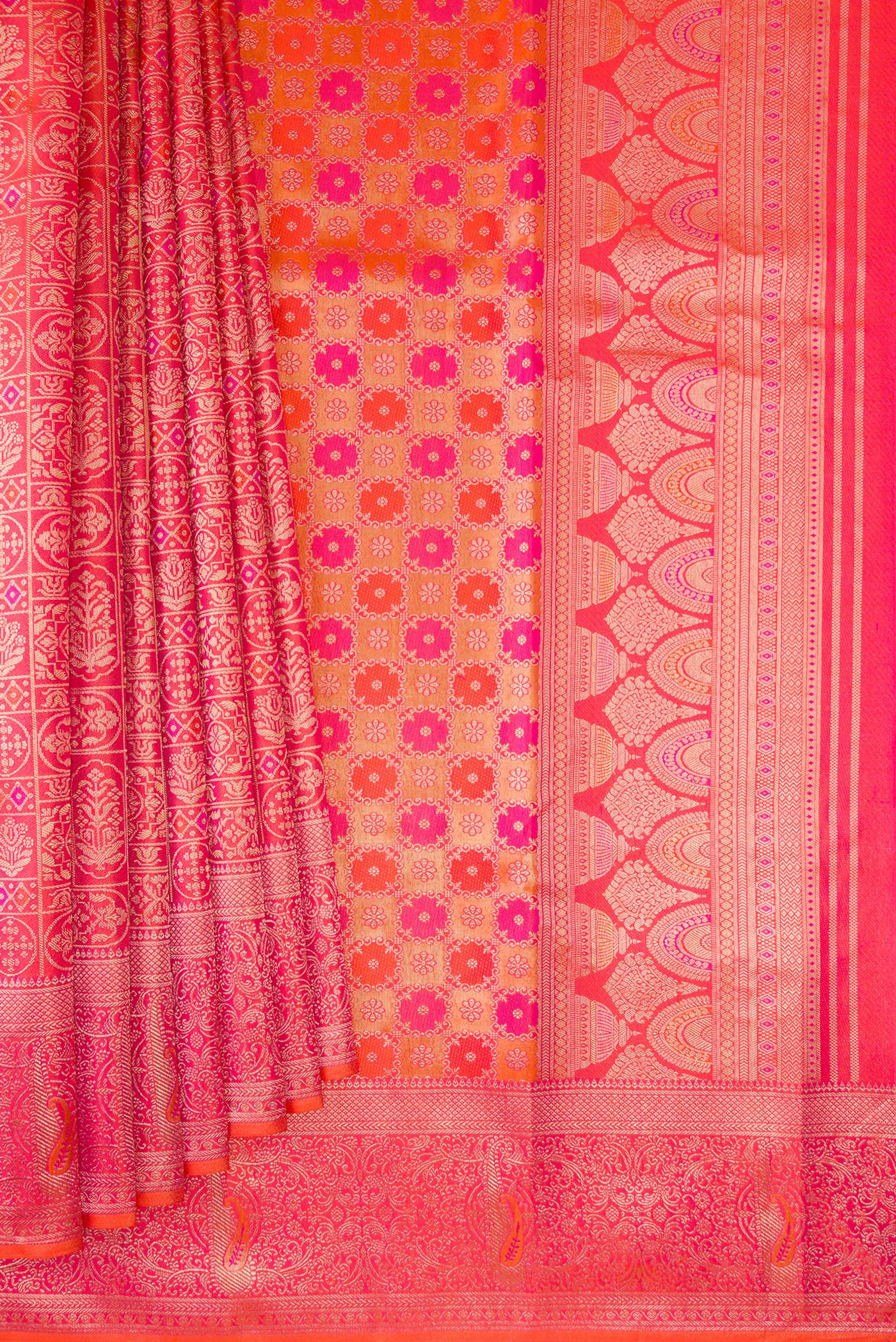 Pleats and pallu of Orange Dual Tone Kanjivaram Silk Saree with Zari Brocade on the body and Fancy Border. 