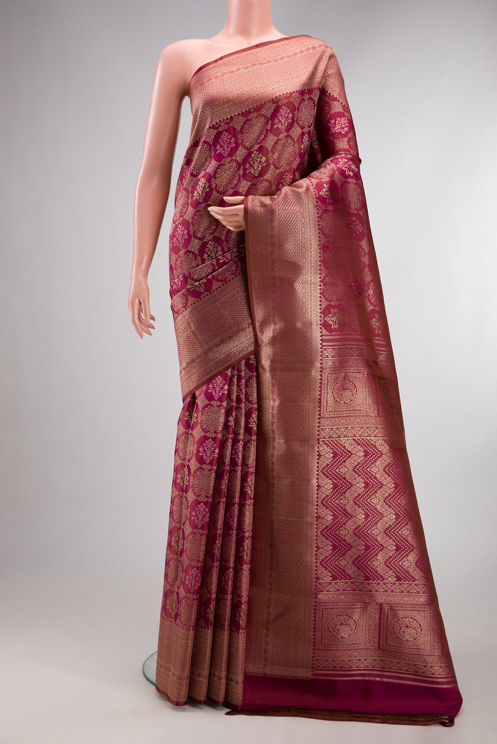 Magenta Dual Tone Kanjivaram Silk Saree with Zari Brocade on the body and Fancy Border.  displayed on a mannequin