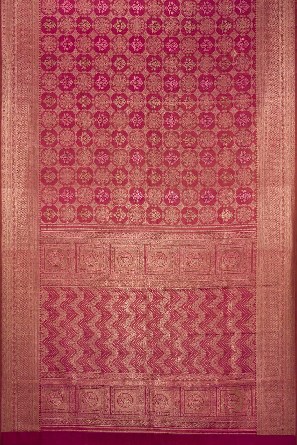 Flat view of Magenta Dual Tone Kanjivaram Silk Saree with Zari Brocade on the body and Fancy Border. 
