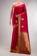 Pure Silk Deep Red Kanjivaram Saree with Zari Butta on the body and Fancy Border.  displayed on a mannequin