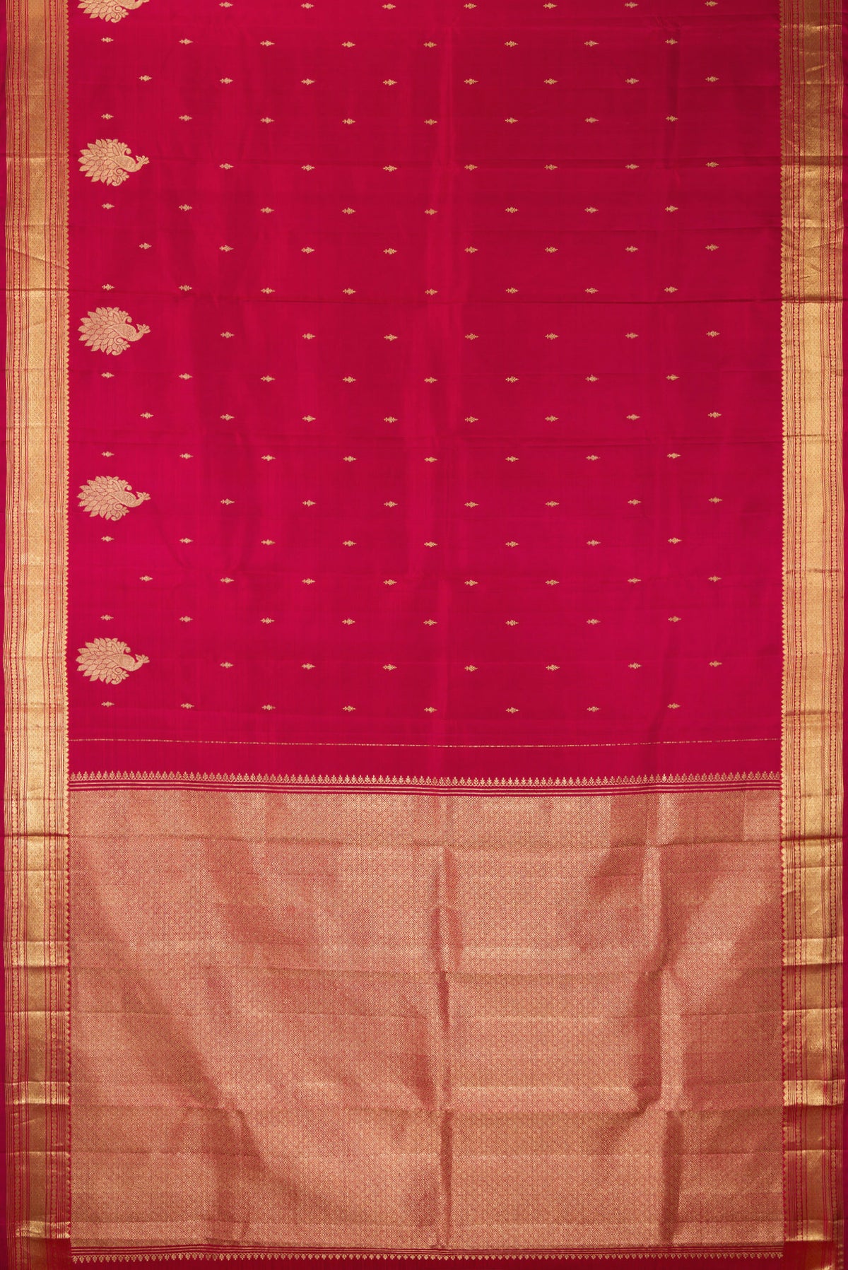 Flat view of Pure Silk Deep Red Kanjivaram Saree with Zari Butta on the body and Fancy Border. 