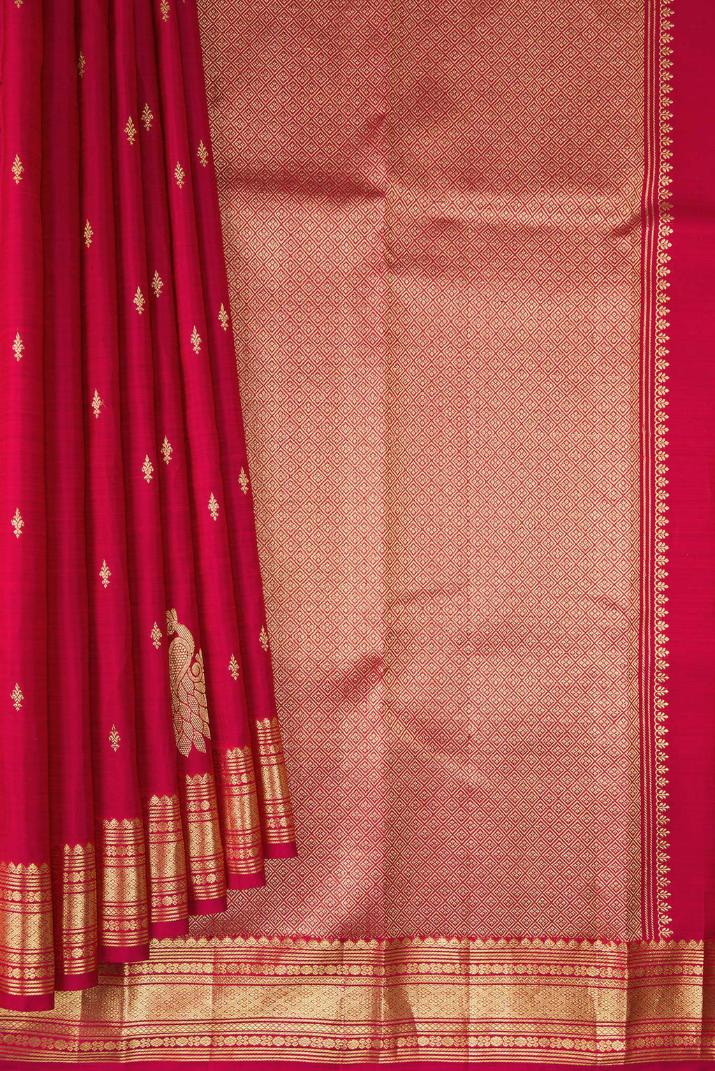 Pleats and pallu of Pure Silk Deep Red Kanjivaram Saree with Zari Butta on the body and Fancy Border. 