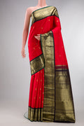 Pure Silk Red Kanjivaram Saree with Zari Butta on the body and Zari Border.  displayed on a mannequin