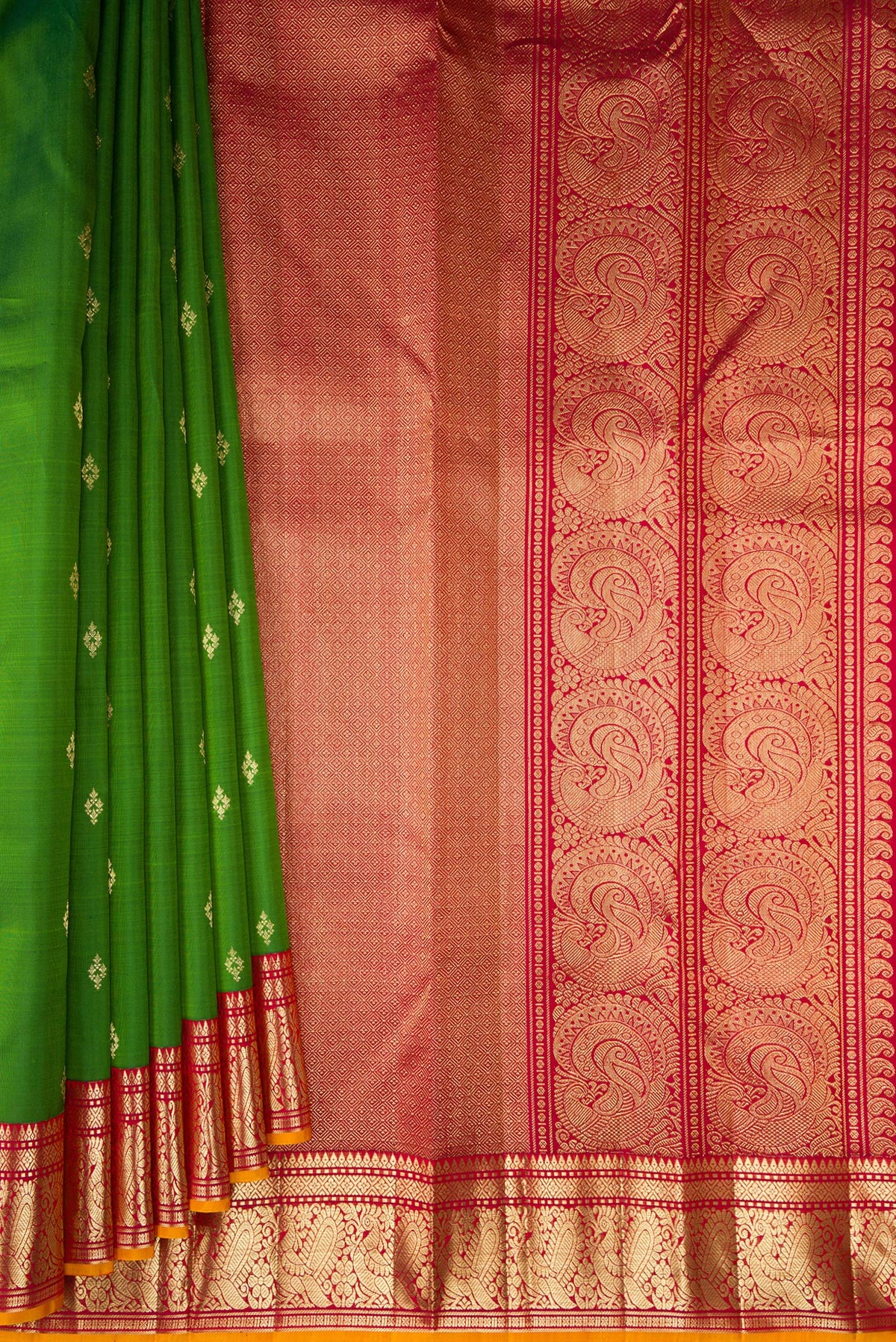 Pleats and pallu of Pure Silk Green Kanjivaram Saree with Zari Butta on the body and Zari Border. 