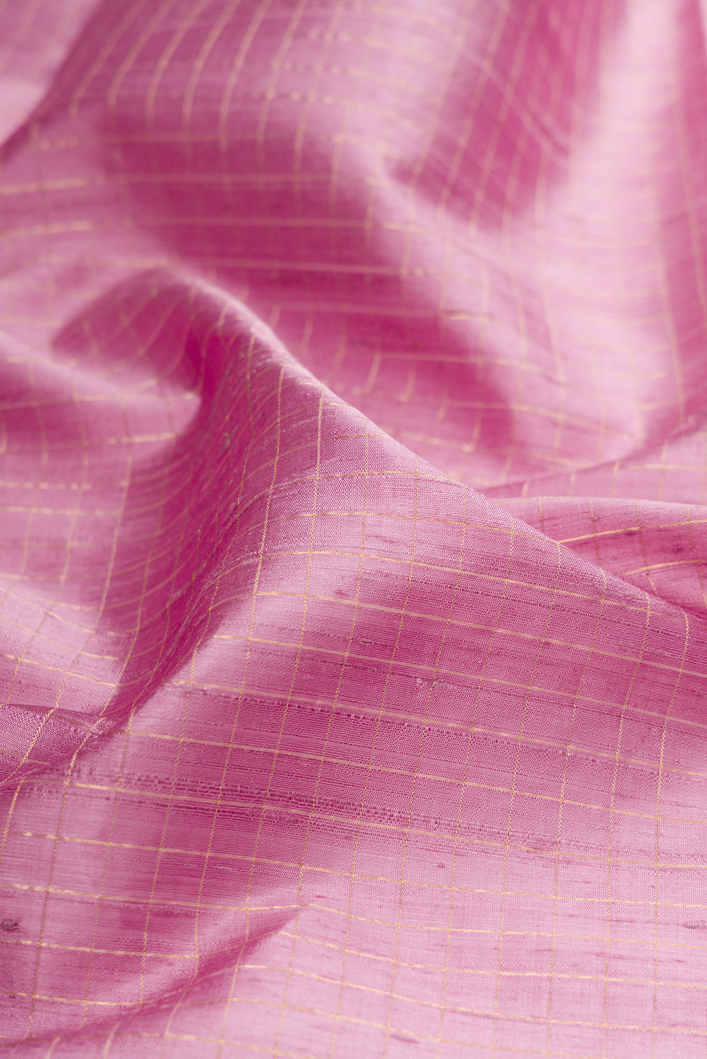 Close up of Pure Silk Lavender Raw Saree with Checked design on the body and Zari Border.  displaying folds