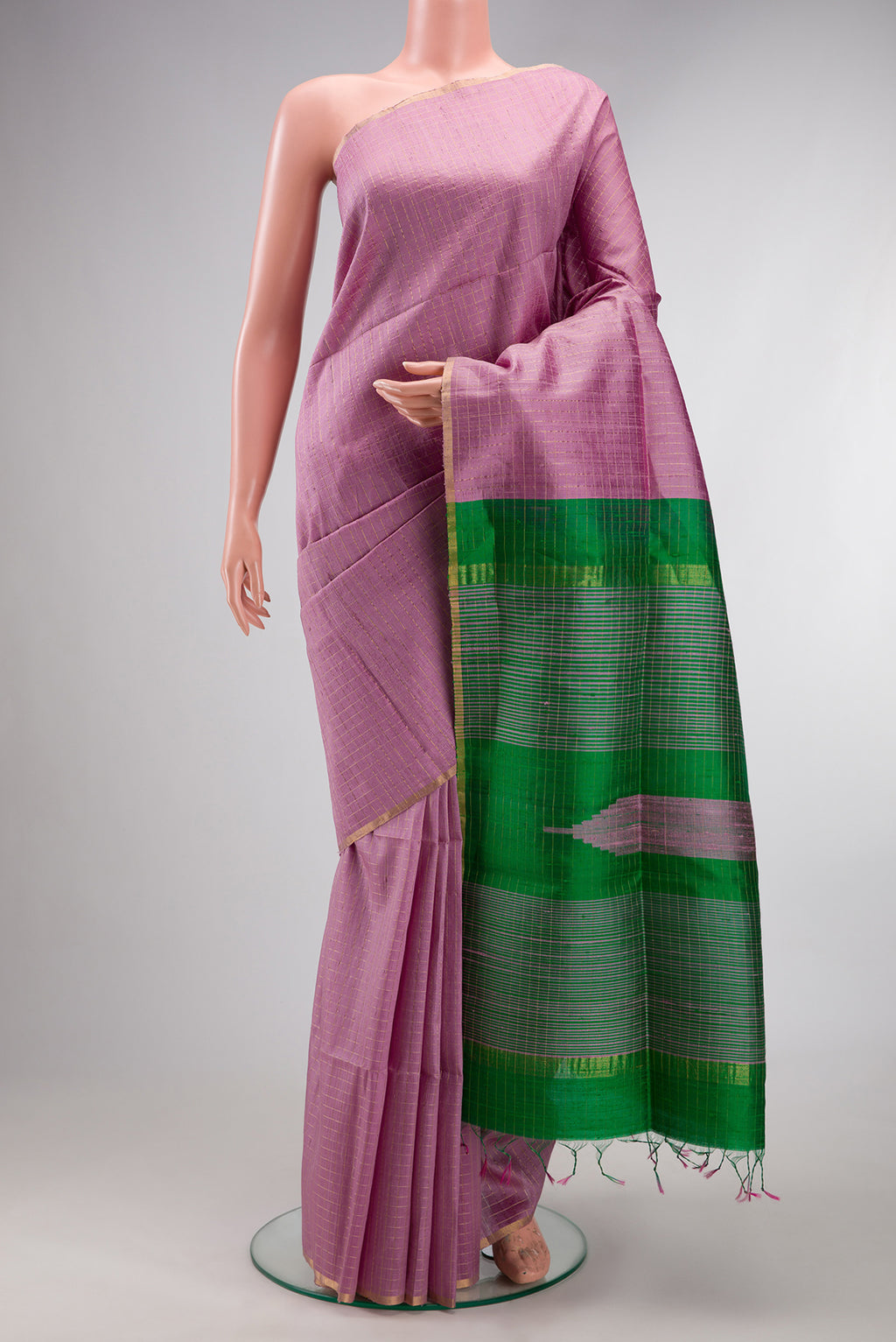Pure Silk Lavender Raw Saree with Checked design on the body and Zari Border.  displayed on a mannequin