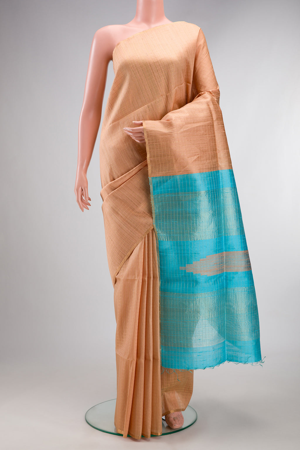 Pure Silk Sandal Raw Saree with Checked design on the body and Zari Border.  displayed on a mannequin