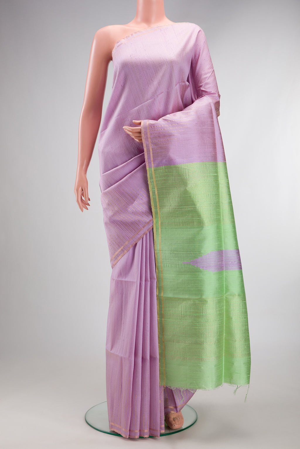 Pure Silk Lavender Raw Saree with Plain Body and Zari Border.  displayed on a mannequin