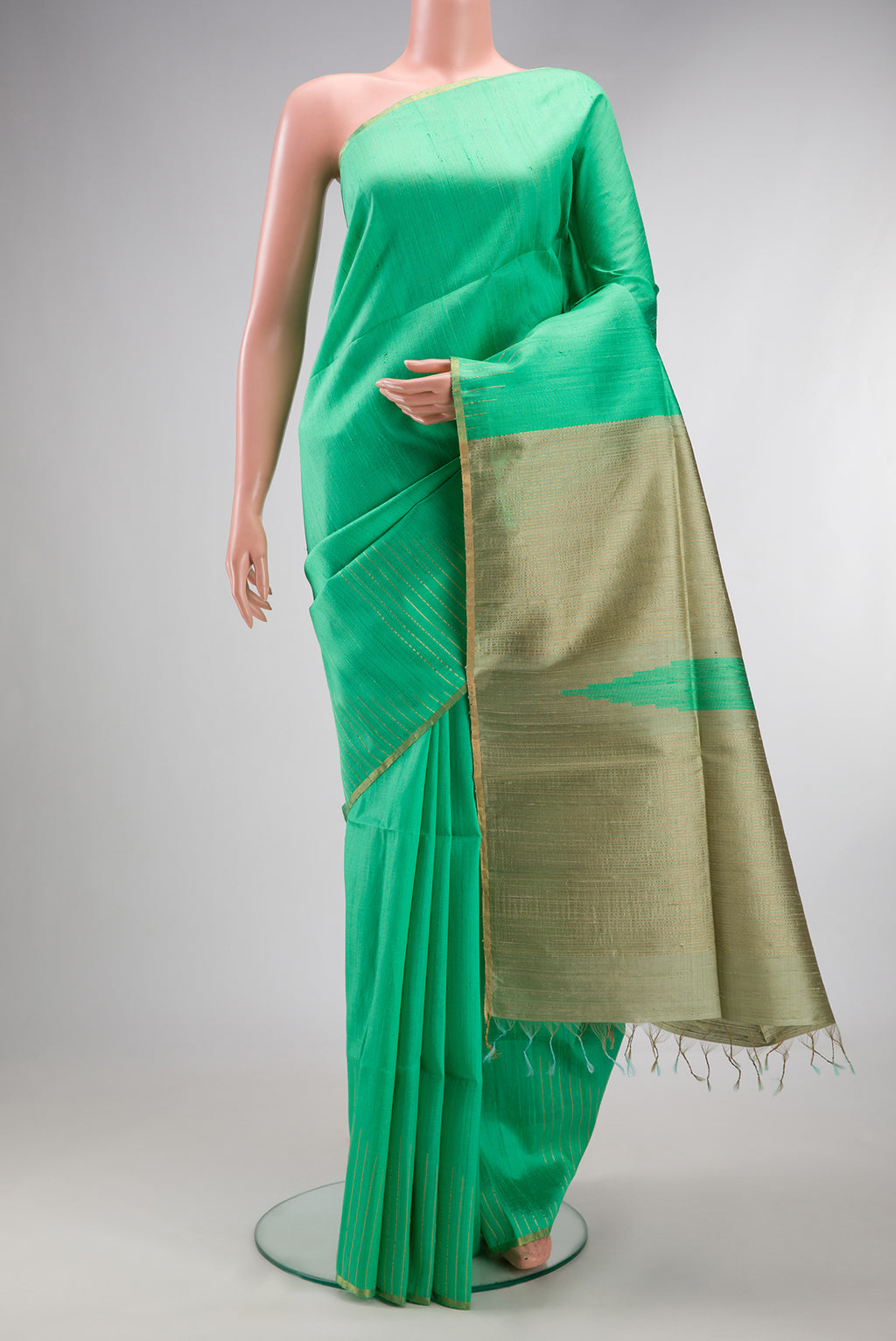 Pure Silk Sea Green Raw Saree with Plain Body and Fancy Border.  displayed on a mannequin