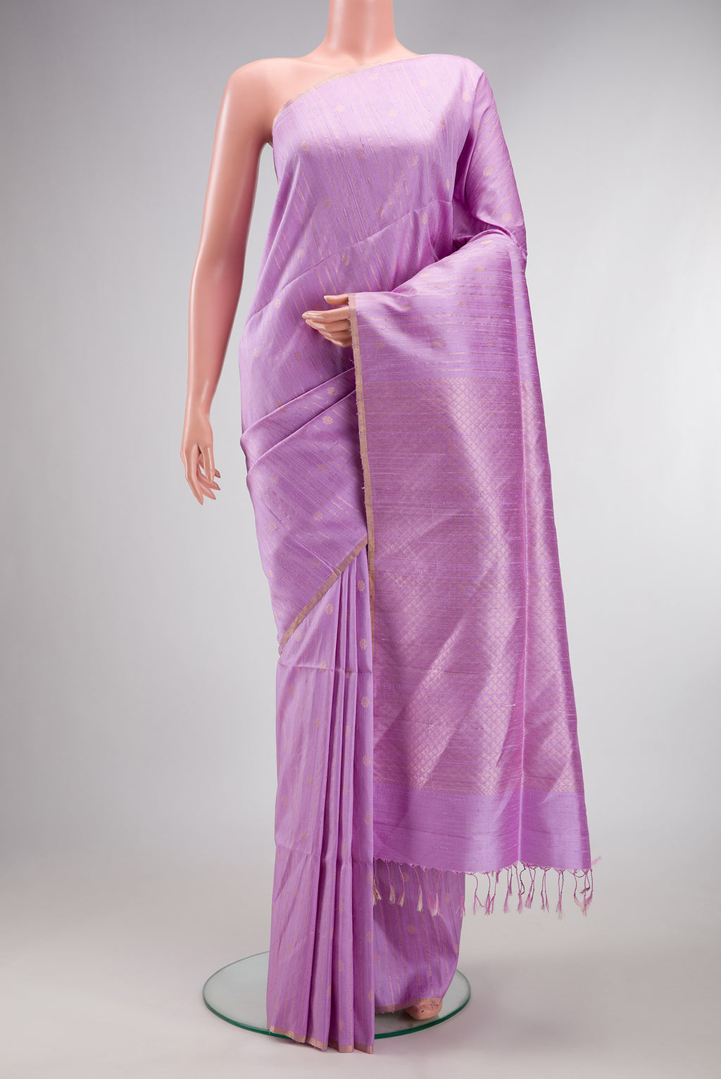 Pure Silk Lavender Raw Saree with Stripes on the body and Zari Border.  displayed on a mannequin