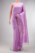 Pure Silk Lavender Raw Saree with Stripes on the body and Zari Border.  displayed on a mannequin
