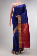 Dark Blue Raw Saree with Zari Butta on the body and Zari Border.  displayed on a mannequin