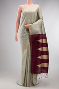 Pure Silk Grey Raw Saree with Stripes on the body and Fancy Border.  displayed on a mannequin