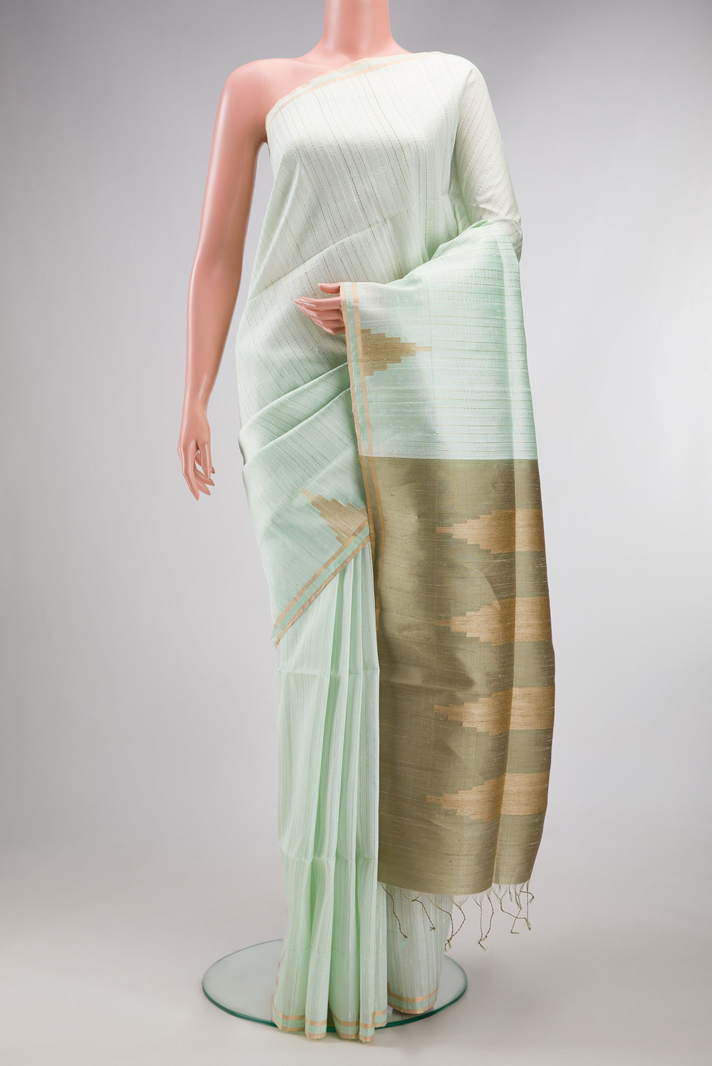 Pure Silk Mint Green Raw Saree with Stripes on the body and Fancy Border.  displayed on a mannequin