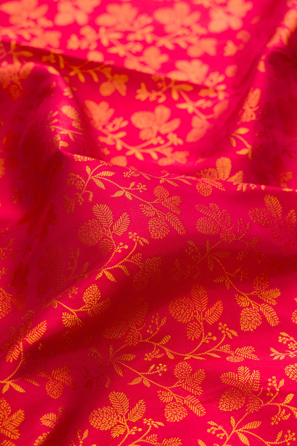 Close up of Pure Silk Red Kanchipuram Saree with Zari Brocade on the body and Zari Border.  displaying folds