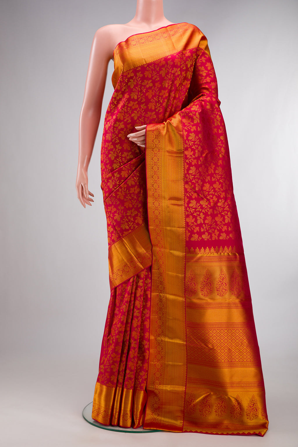Pure Silk Red Kanchipuram Saree with Zari Brocade on the body and Zari Border.  displayed on a mannequin