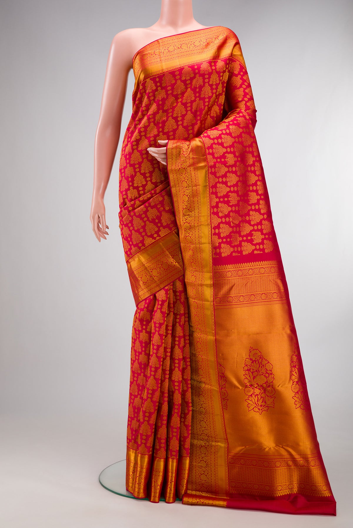 Pure Silk Red Kanchipuram Saree with Zari Brocade on the body and Zari Border.  displayed on a mannequin