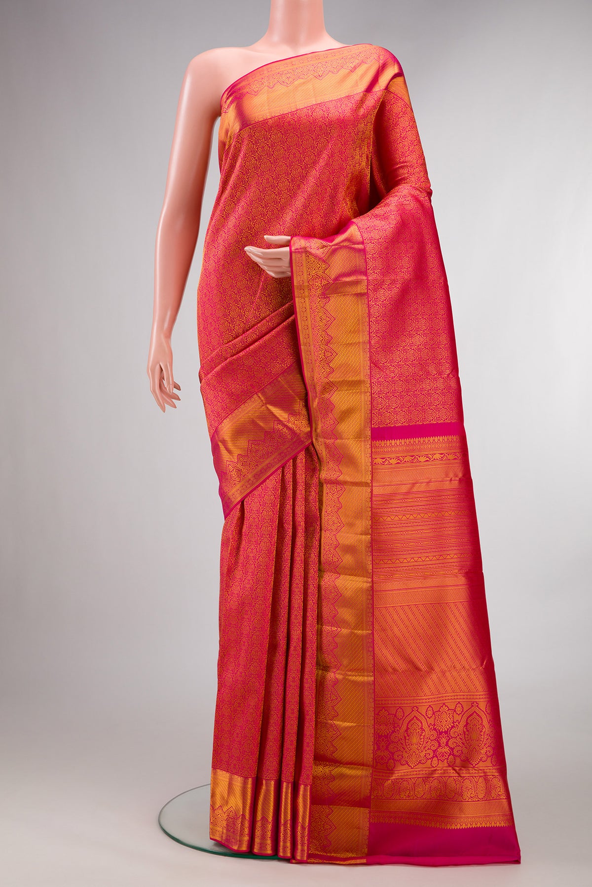 Pure Silk Dark Pink Dual Tone Kanchipuram Saree with Zari Brocade on the body and Zari Border.  displayed on a mannequin