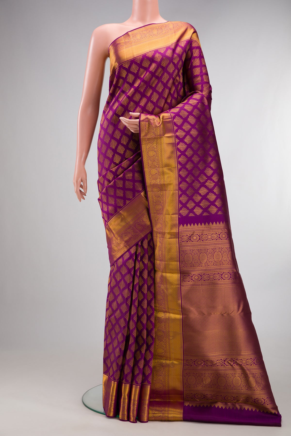 Pure Silk Purple Kanchipuram Saree with Zari Brocade on the body and Zari Border.  displayed on a mannequin