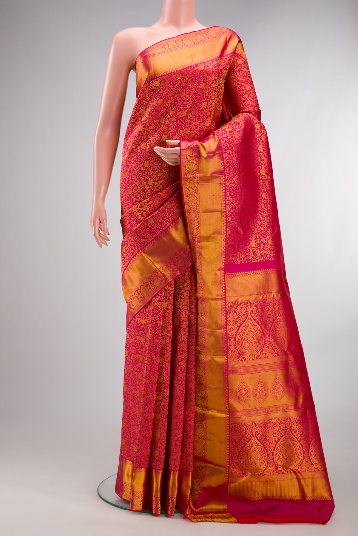 Pure Silk Pink Kanchipuram Saree with Zari Brocade on the body and Zari Border.  displayed on a mannequin