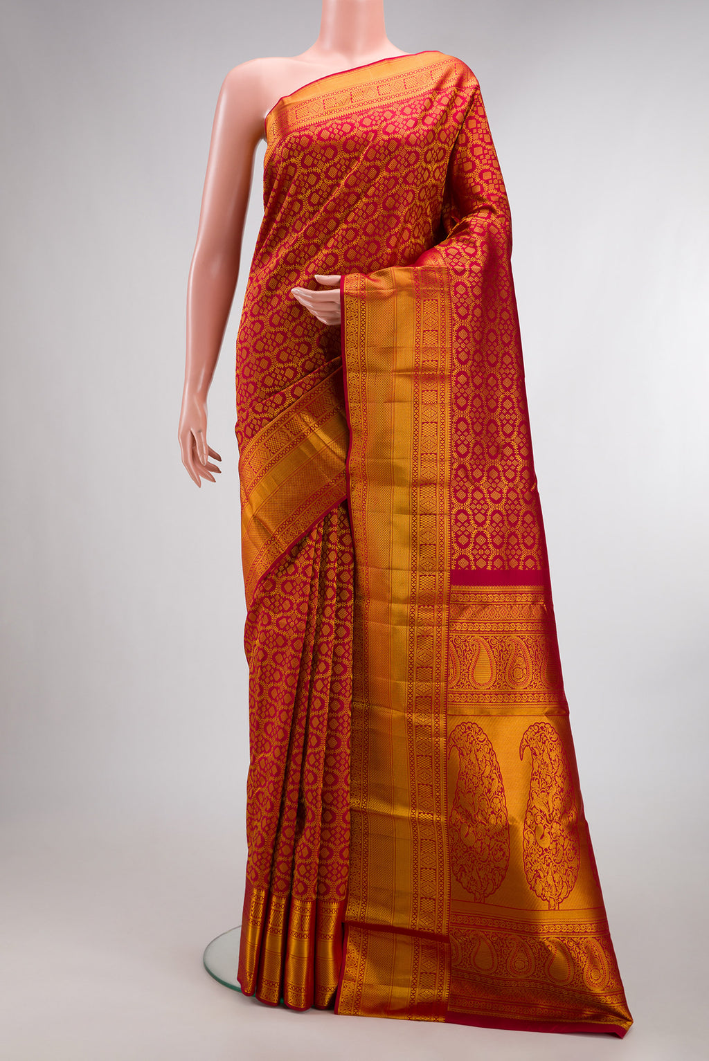 Pure Silk Red Kanchipuram Saree with Zari Brocade on the body and Zari Border.  displayed on a mannequin