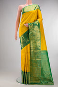 Pure Silk Yellow Kanjivaram Saree with Zari Brocade on the body and Zari Border.  displayed on a mannequin