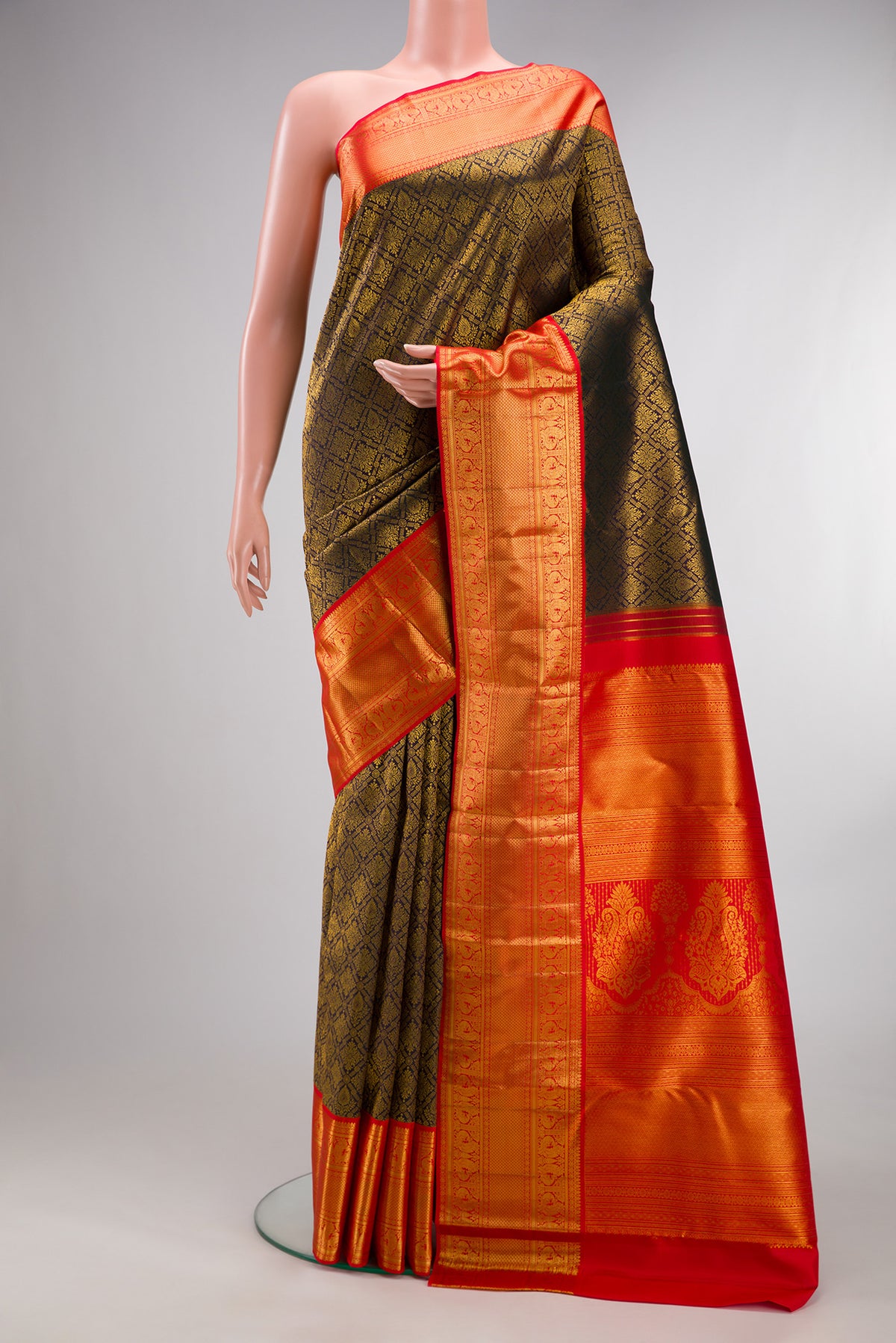 Pure Silk Bottle Green Dual Tone Kanjivaram Saree with Zari Brocade on the body and Zari Border.  displayed on a mannequin