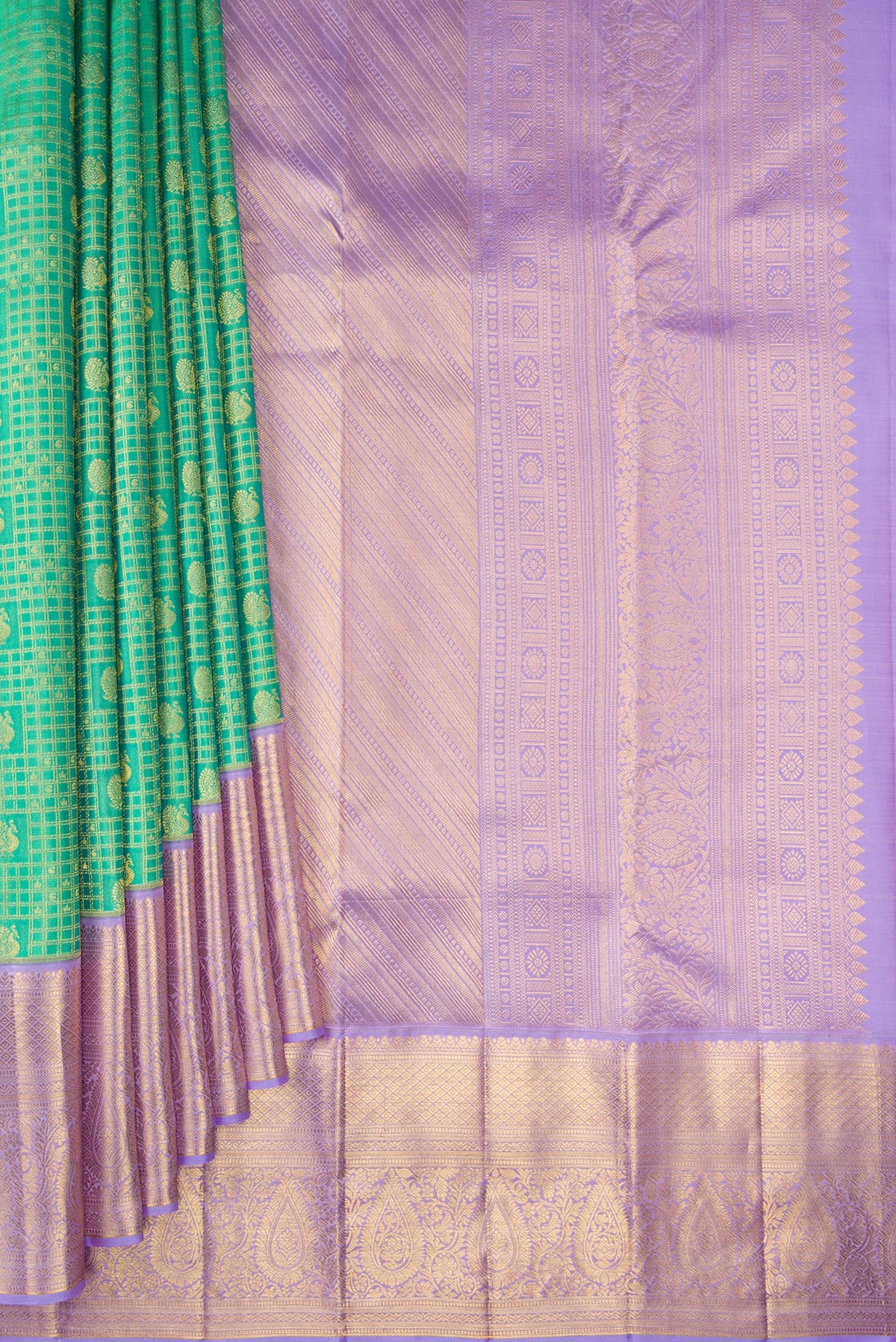 Pleats and pallu of Green Kanjivaram Silk Saree with Zari Brocade on the body and Zari Border. 