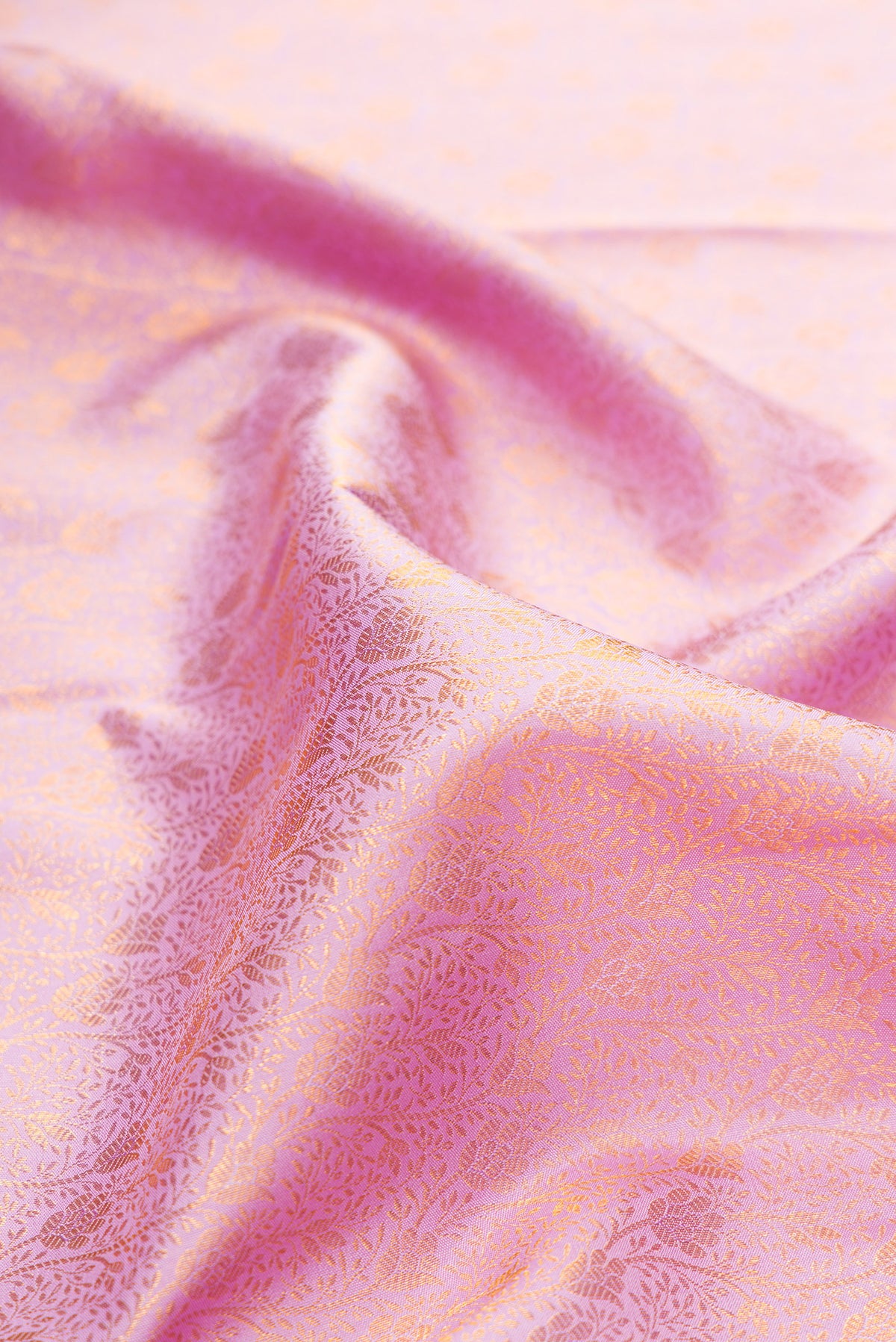 Close up of Pure Silk Lavender Kanjivaram Saree with Zari Brocade on the body and Zari Border.  displaying folds