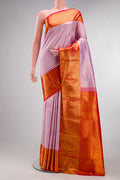 Pure Silk Lavender Kanjivaram Saree with Zari Brocade on the body and Zari Border.  displayed on a mannequin
