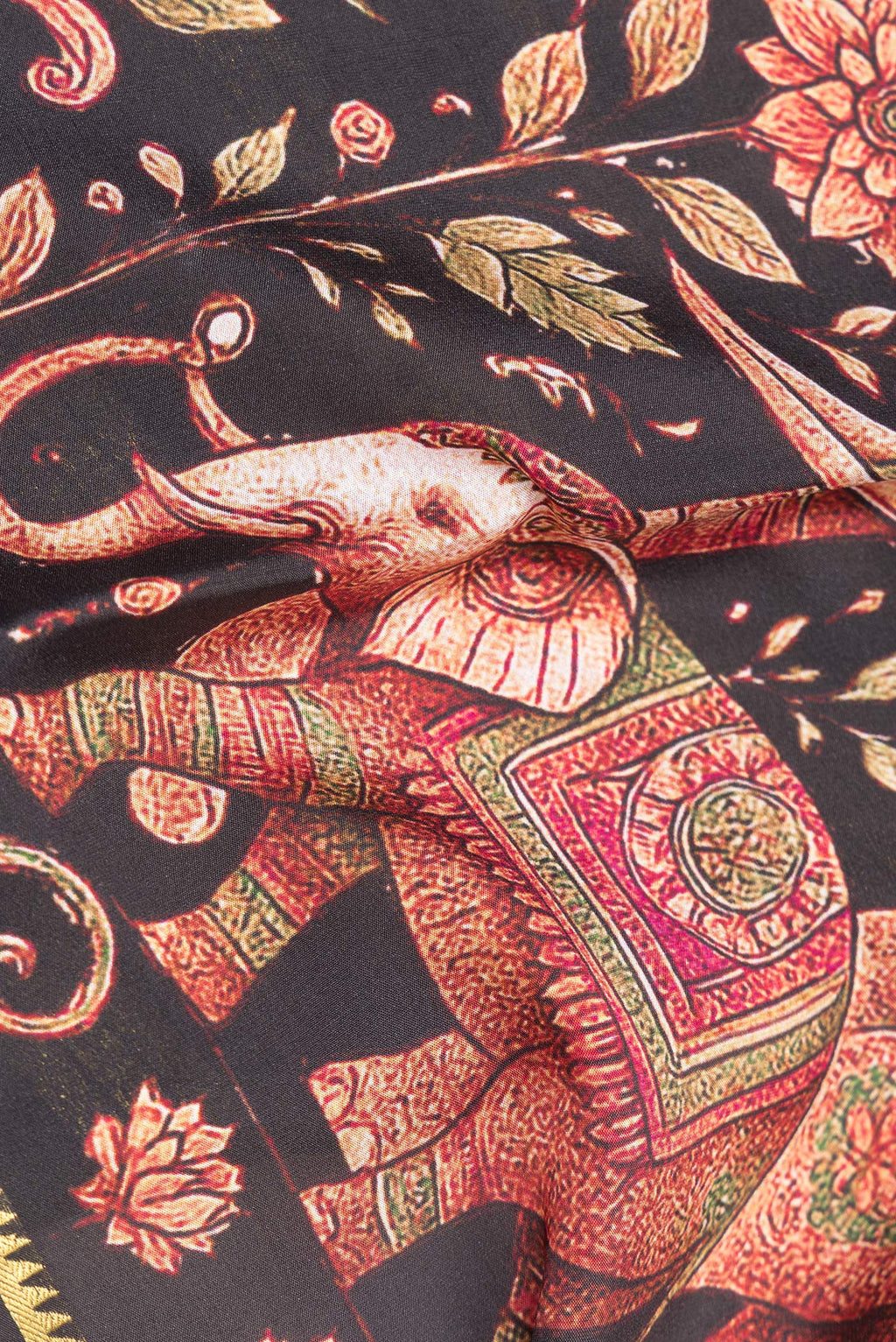 Close up of Pure Silk Black Dual Tone Mysore Silk Saree with Printed design on the body and Zari Border.  displaying folds
