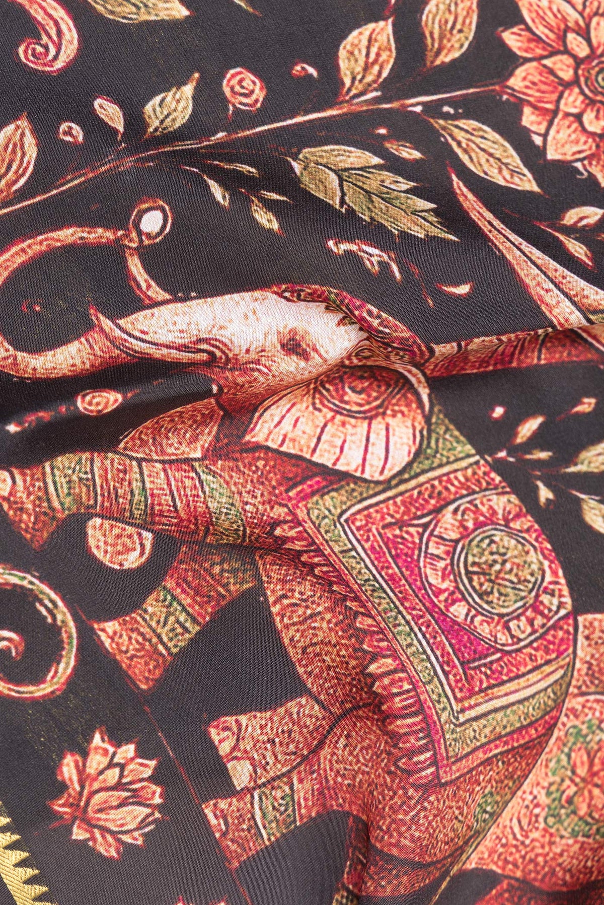 Close up of Pure Silk Black Dual Tone Mysore Silk Saree with Printed design on the body and Zari Border.  displaying folds