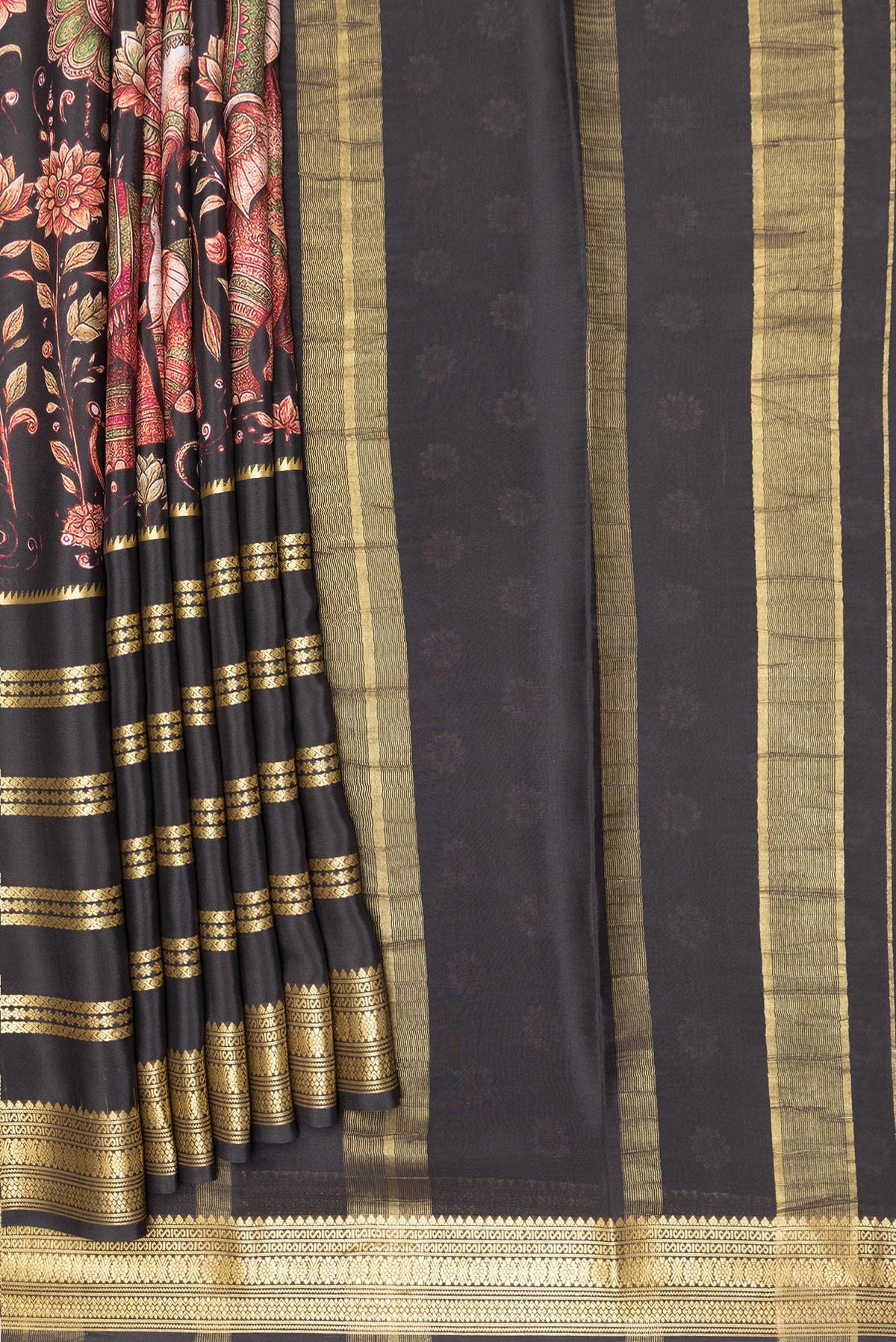 Pleats and pallu of Pure Silk Black Dual Tone Mysore Silk Saree with Printed design on the body and Zari Border. 