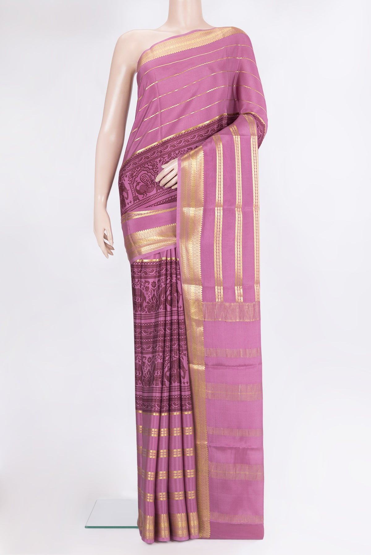 Light Magenta Mysore Crepe Saree with Printed design on the body and Zari Border.  displayed on a mannequin