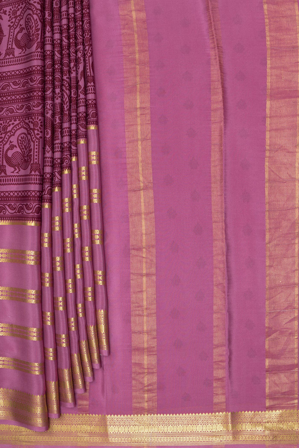 Pleats and pallu of Light Magenta Mysore Crepe Saree with Printed design on the body and Zari Border. 