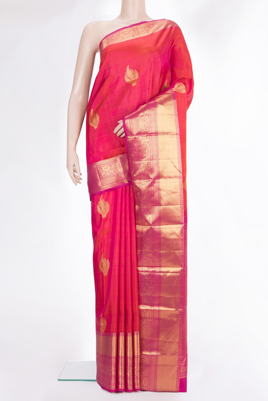 Pure Silk Orange Dual Tone Kanchipuram Saree with Zari Butta on the body and Zari Border.  displayed on a mannequin