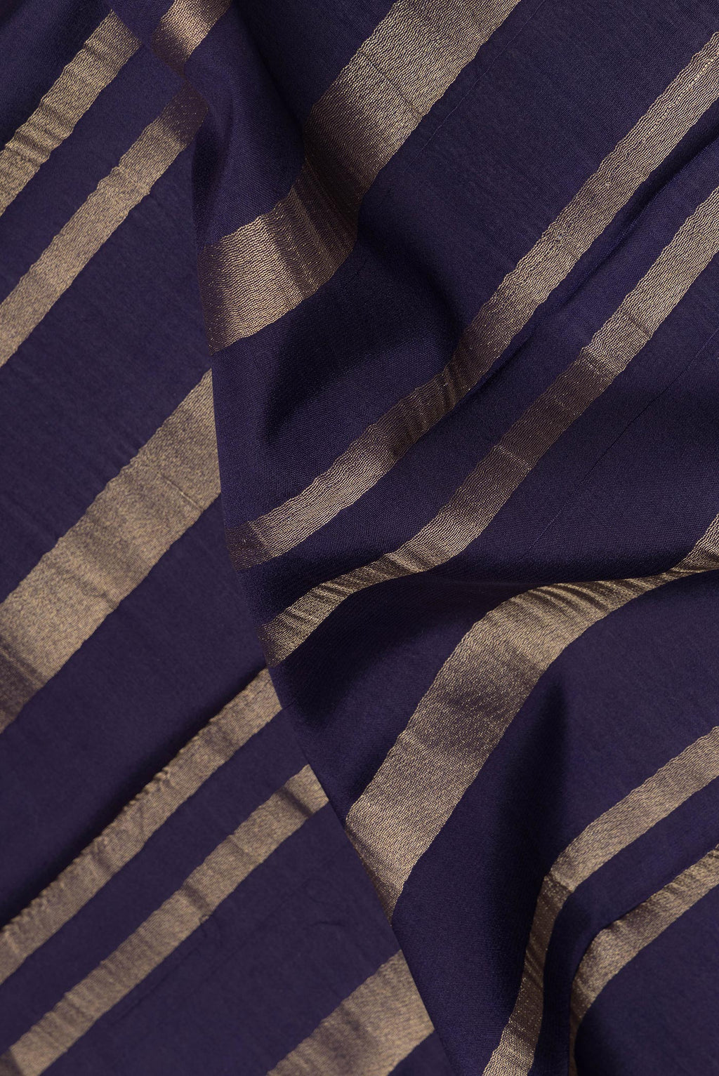 Close up of Navy Blue Mysore Crepe Saree with Stripes on the body and Fancy Border.  displaying folds