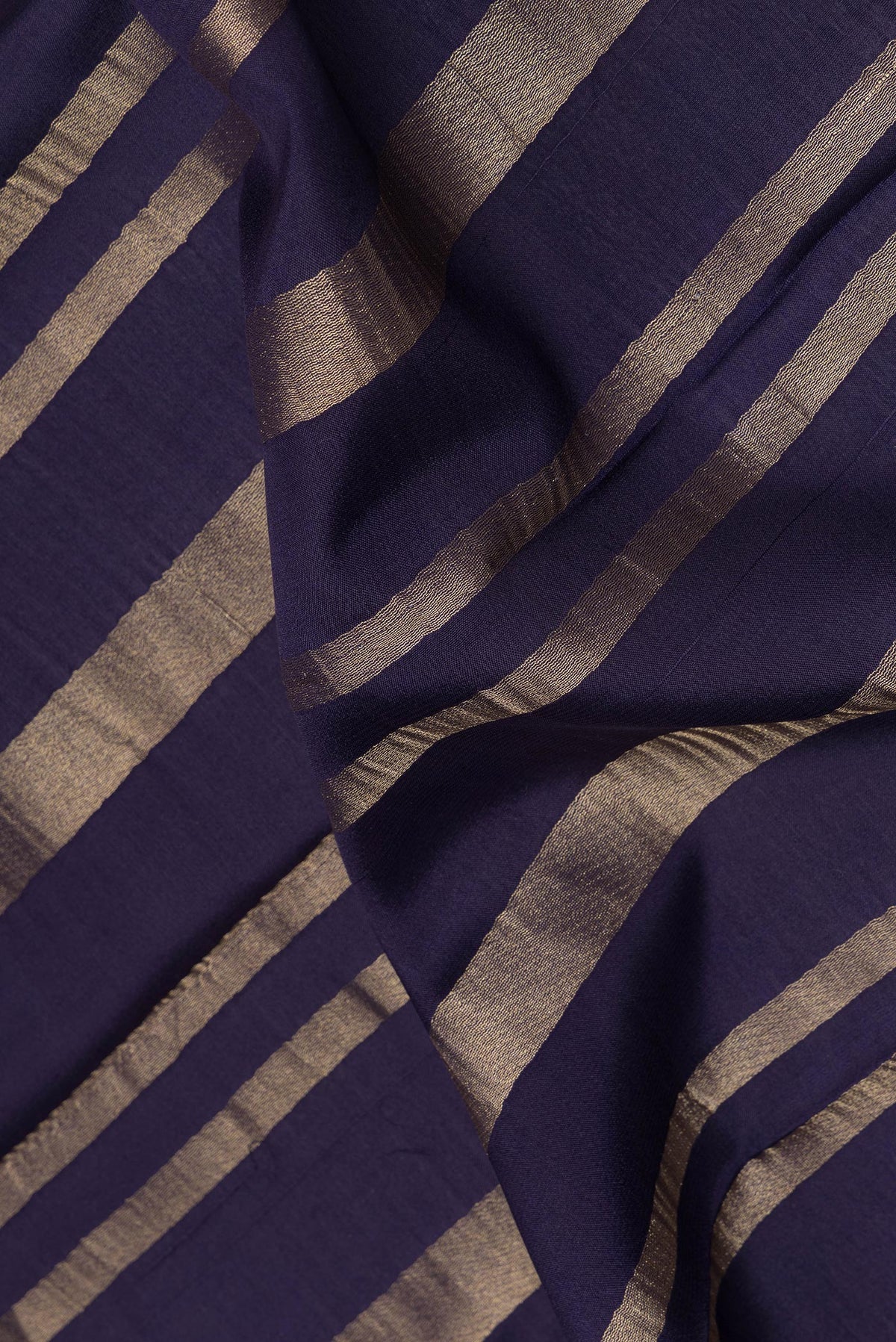 Close up of Navy Blue Mysore Crepe Saree with Stripes on the body and Fancy Border.  displaying folds