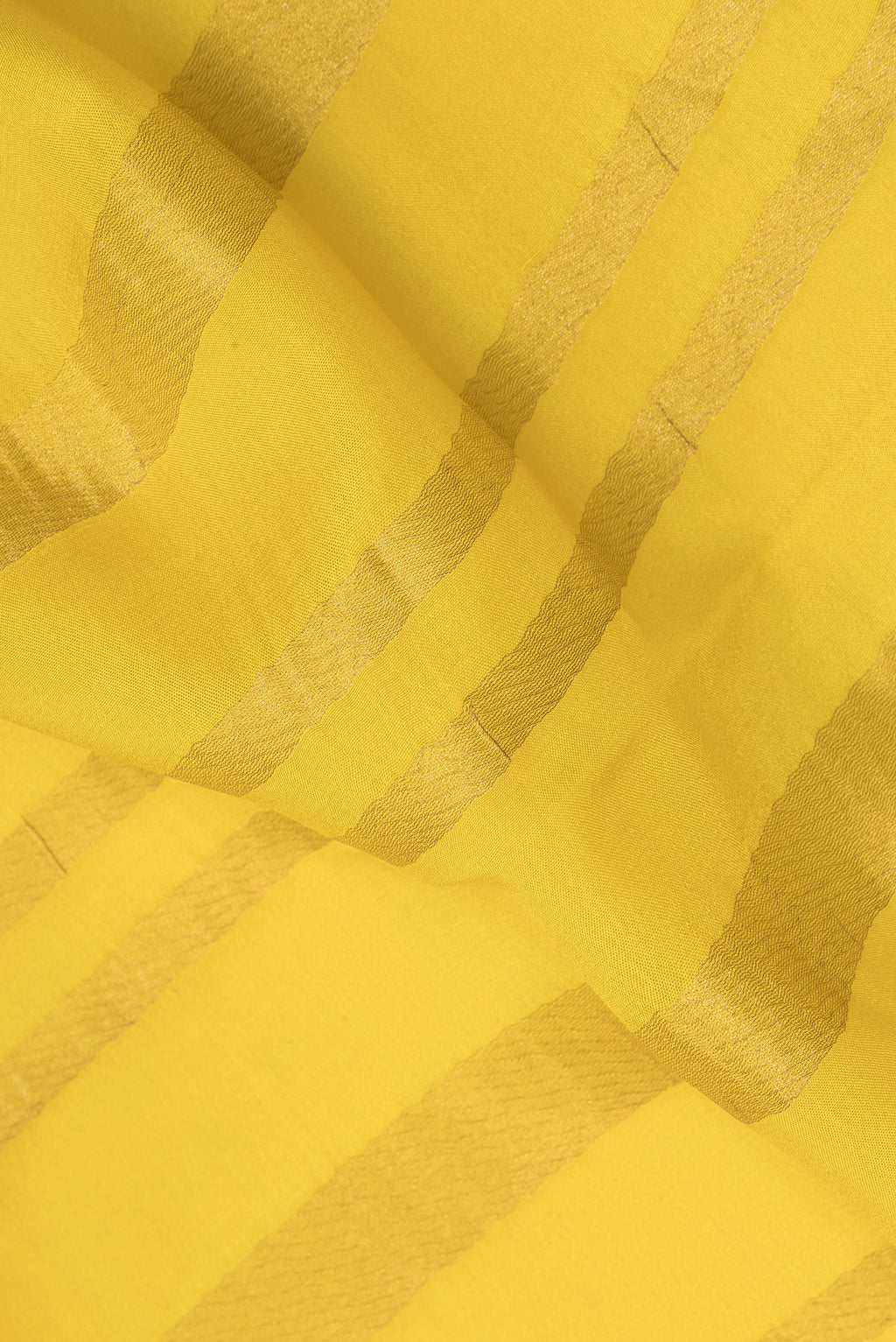 Close up of Lemon Yellow Mysore Crepe Saree with Stripes on the body and Zari Border.  displaying folds