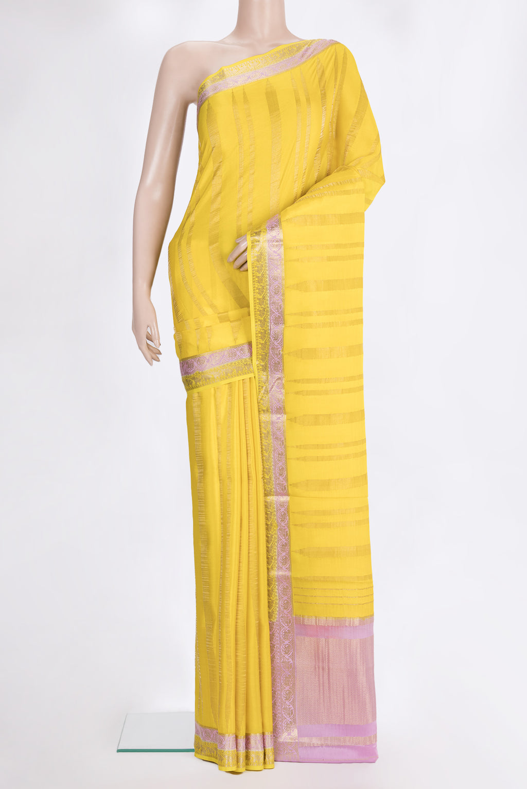 Lemon Yellow Mysore Crepe Saree with Stripes on the body and Zari Border.  displayed on a mannequin