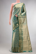 Sea Green Dual Tone Kanchipuram Tissue Saree with Zari Brocade on the body and Zari Border.  displayed on a mannequin