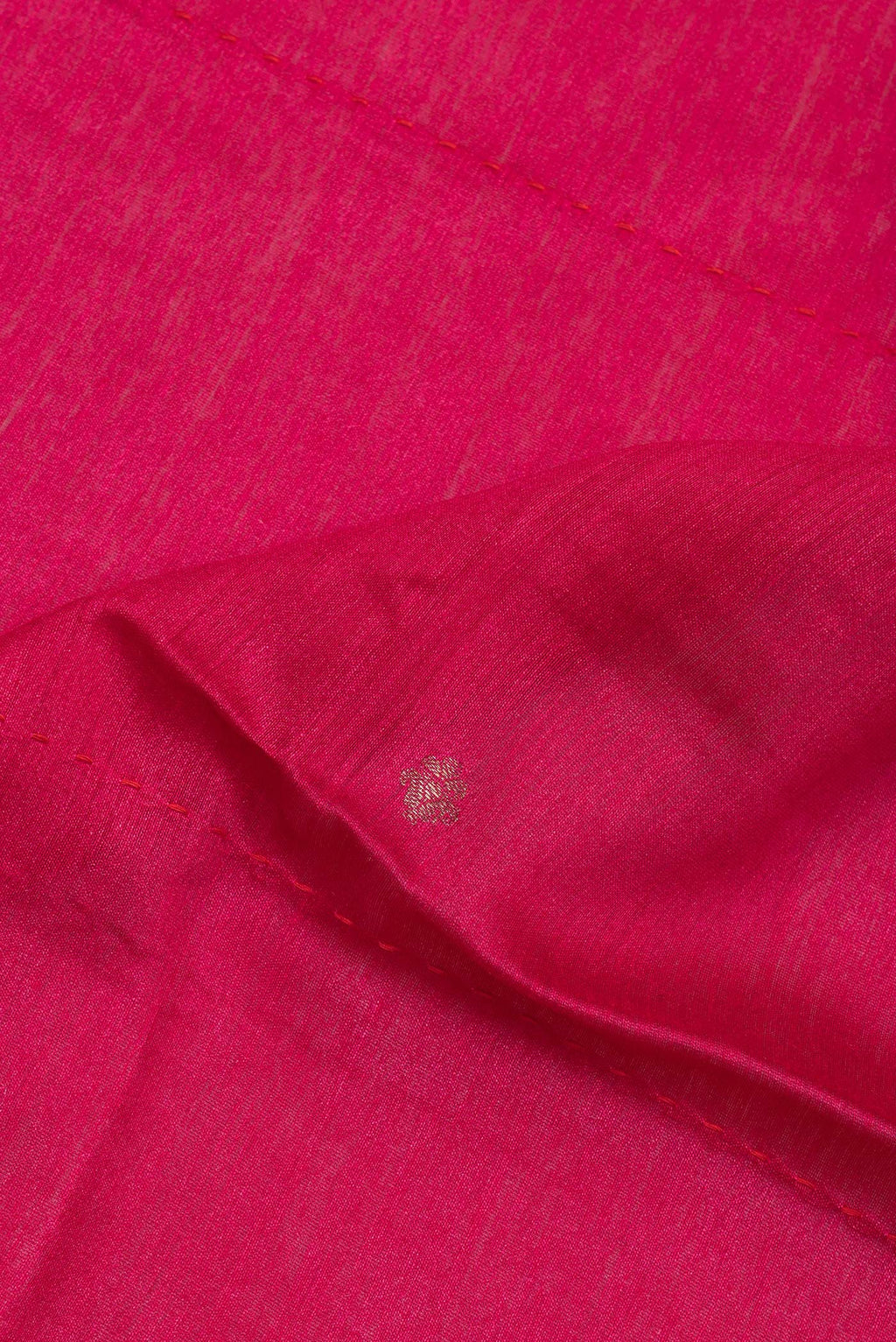 Close up of Pure Silk Dark Pink Dual Tone Tussar Saree with Zari Butta on the body and Fancy Border.  displaying folds